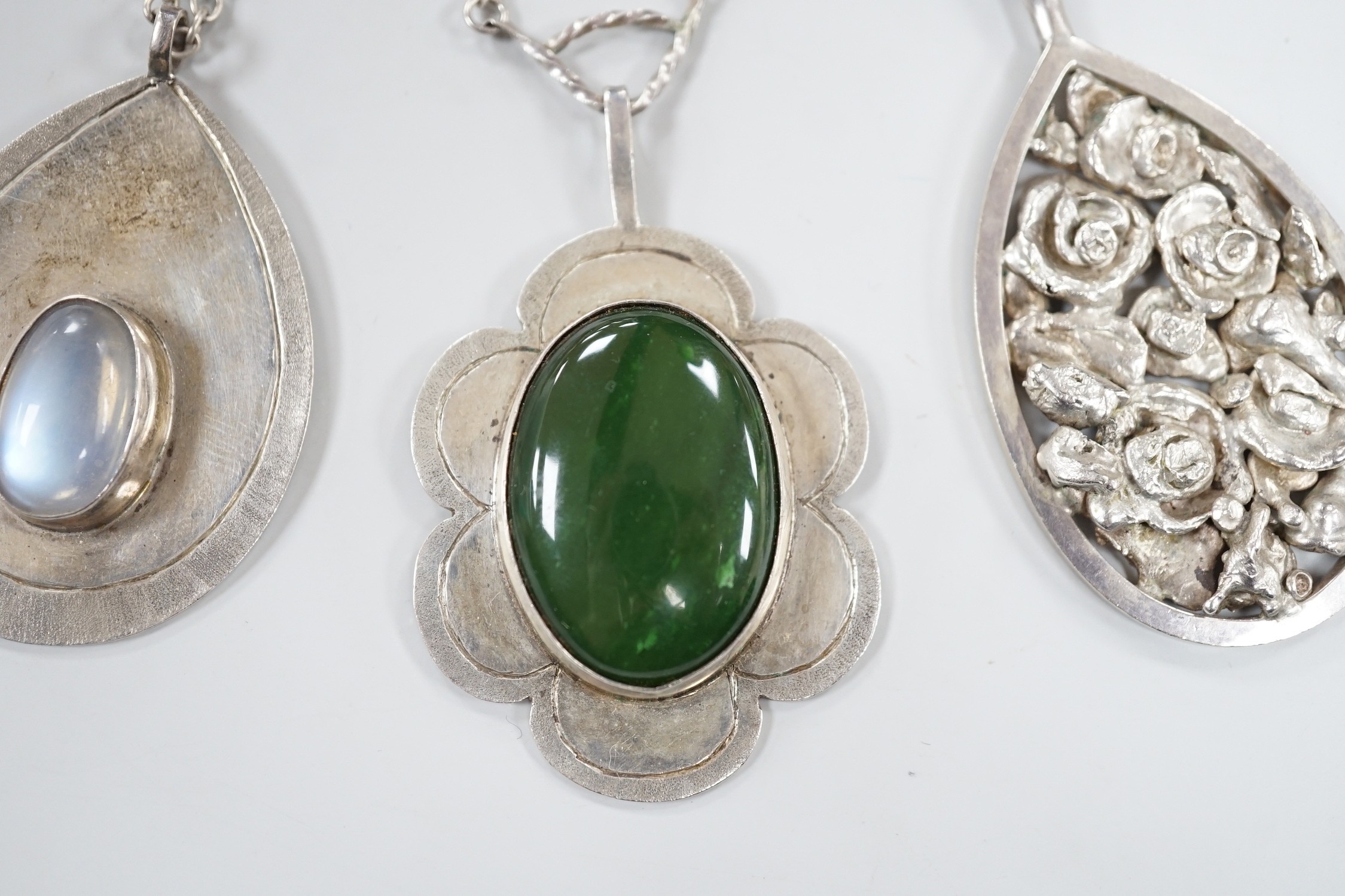 Three modern silver pendants by H.A. Crawshaw? including moonstone set pear shaped pendant, 53mm, all with chains.